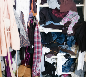 cluttered closet, piles of clothes, professional organizer